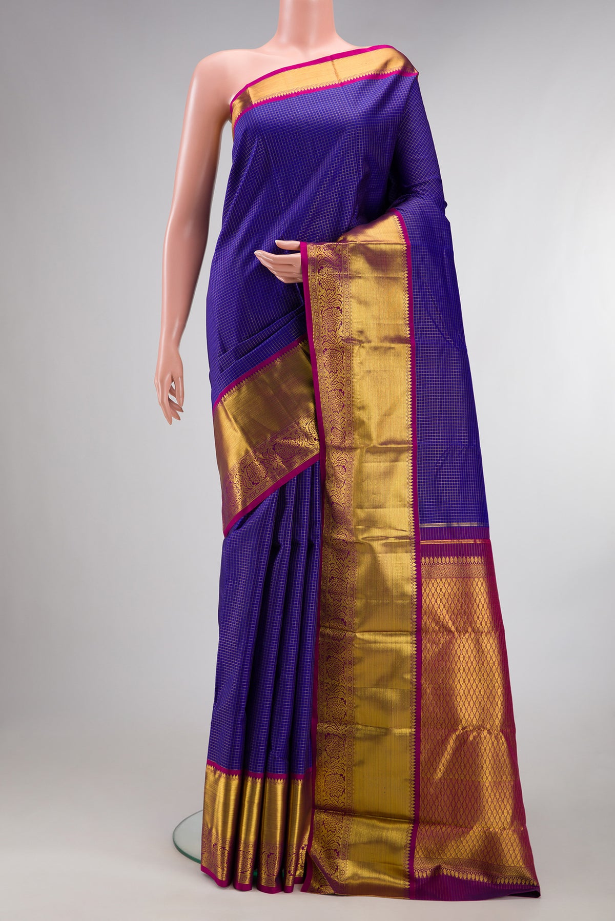 Pure Silk Dark Blue Kanjivaram Saree with Checked design on the body and Zari Border.  displayed on a mannequin