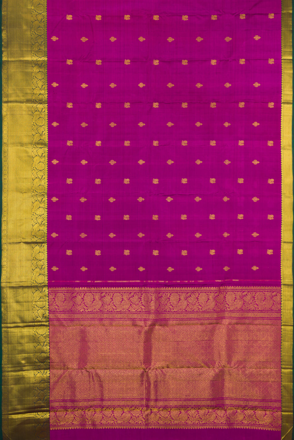 Flat view of Pure Silk Magenta Kanjivaram Saree with Zari Butta on the body and Zari Border. 