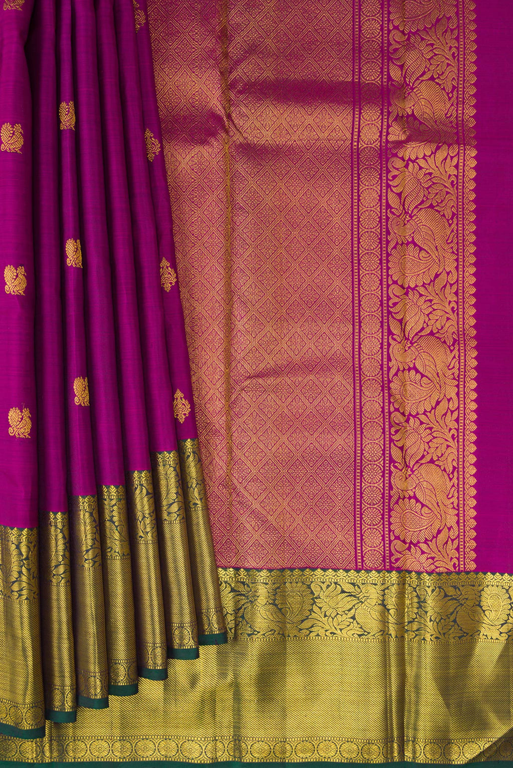 Pleats and pallu of Pure Silk Magenta Kanjivaram Saree with Zari Butta on the body and Zari Border. 