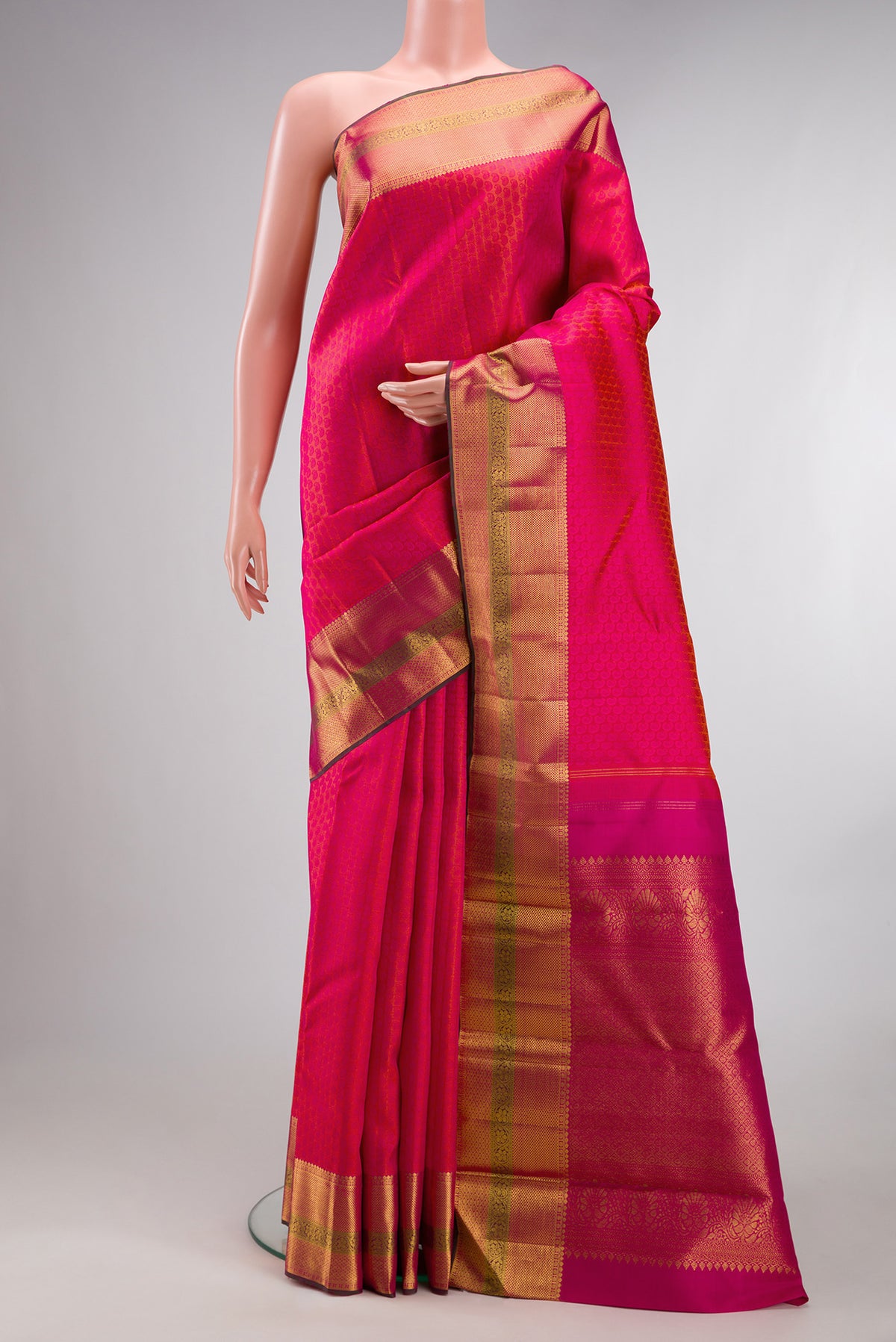 Pure Silk Pink Dual Tone Kanchipuram Saree with Jacquard design on the body and Zari Border.  displayed on a mannequin