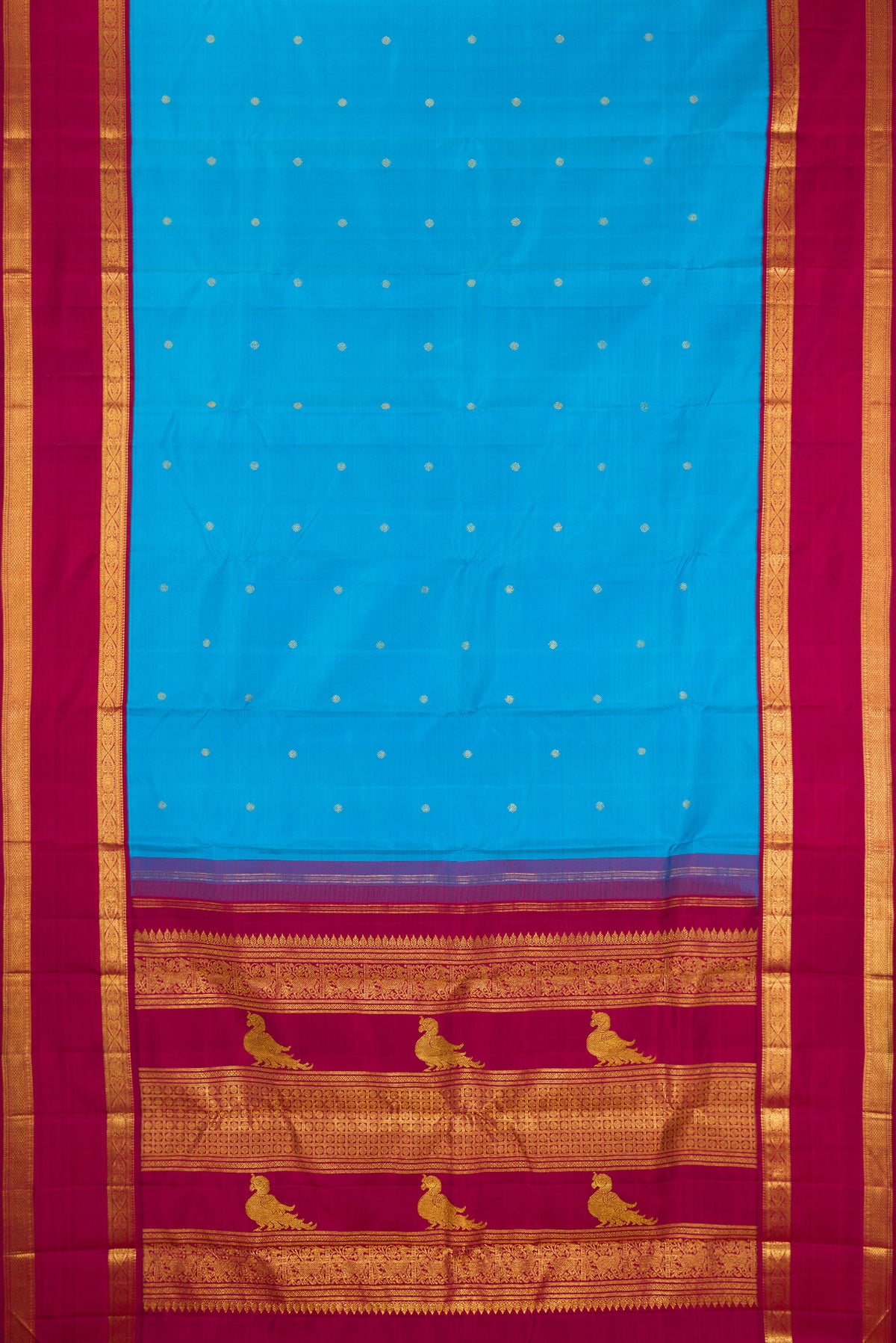 Flat view of Pure Silk Sky Blue Kanjivaram Saree with Zari Butta on the body and Zari Border. 