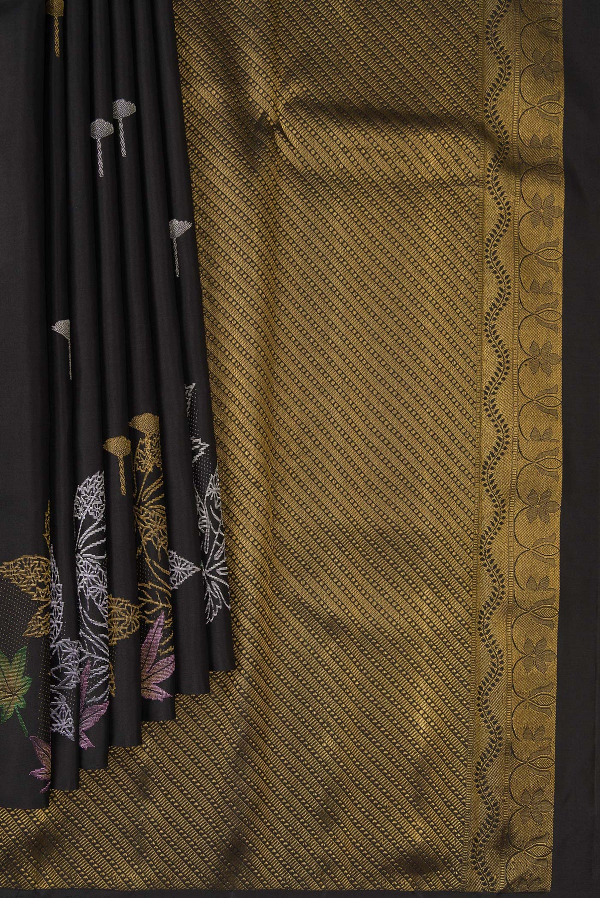 Pleats and pallu of Pure Silk Black Kanchipuram Saree with Zari Butta on the body and Without Border. 
