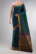 Pure Silk Peacock Blue Kanjivaram Saree with Stripes on the body and Zari Border.  displayed on a mannequin