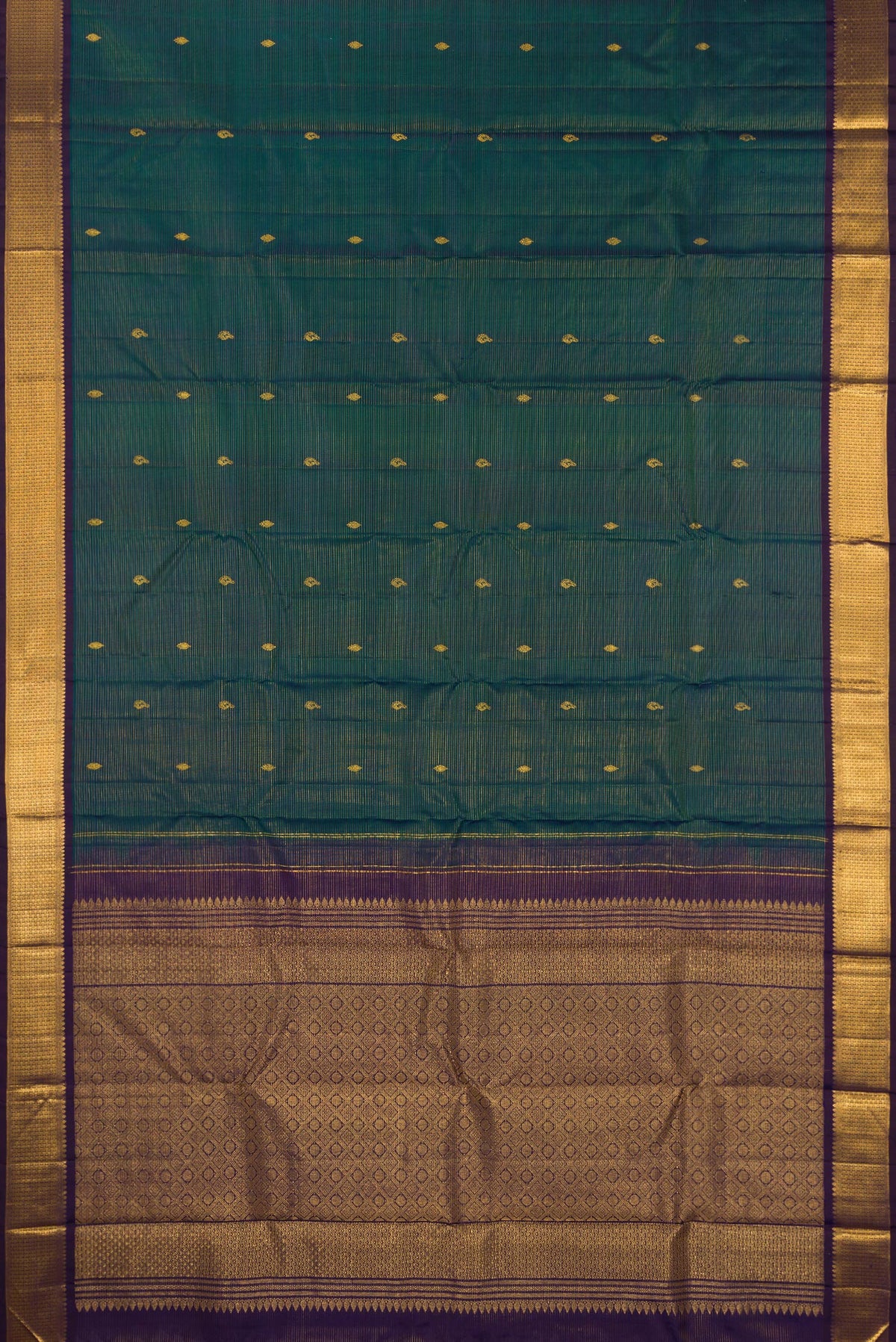 Flat view of Pure Silk Peacock Blue Kanjivaram Saree with Stripes on the body and Zari Border. 