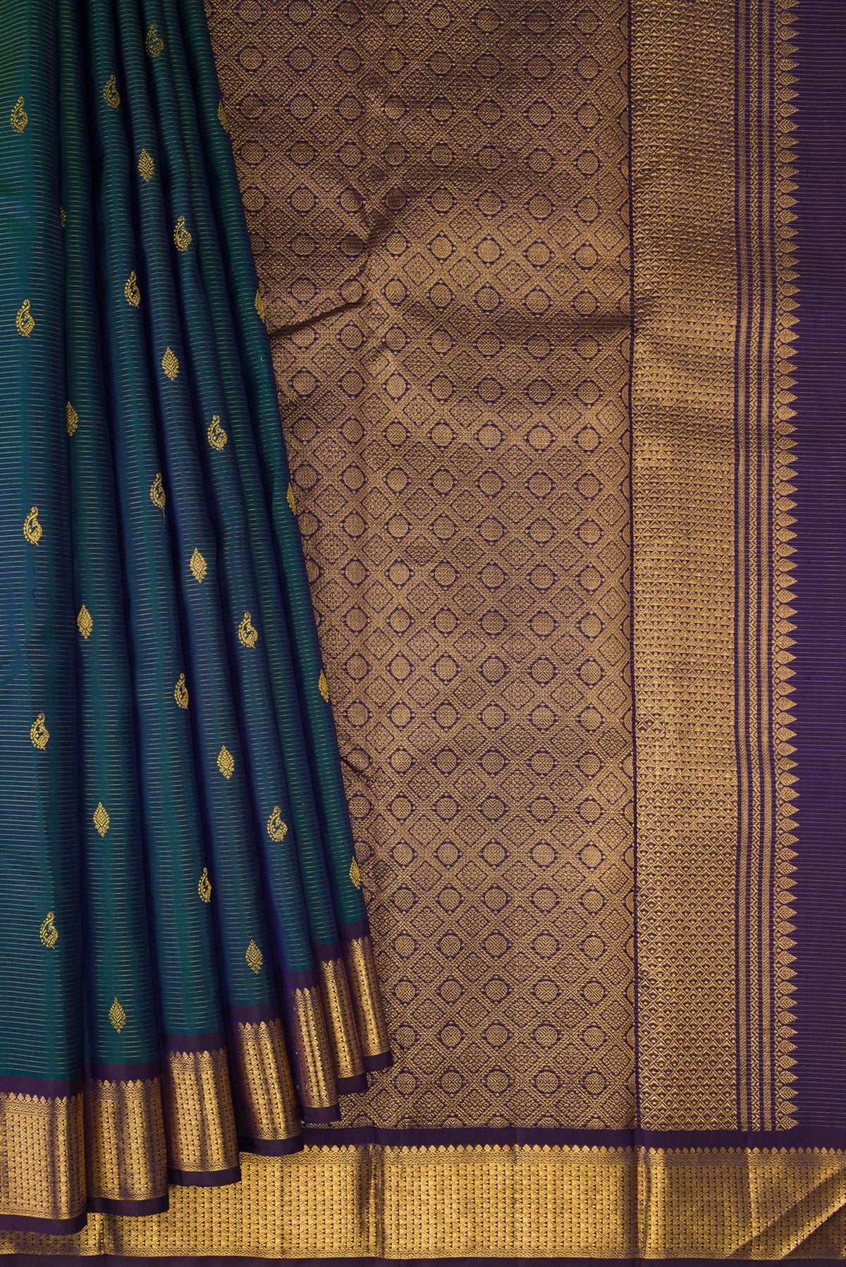 Pleats and pallu of Pure Silk Peacock Blue Kanjivaram Saree with Stripes on the body and Zari Border. 