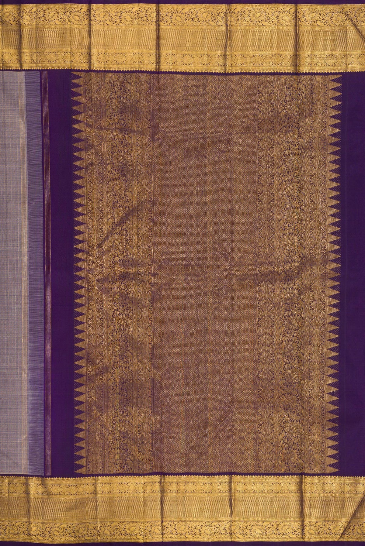 Close up image of the pallu of Pure Silk Lilac Dual Tone Kanjivaram Saree with Zari Butta on the body and Zari Border. 