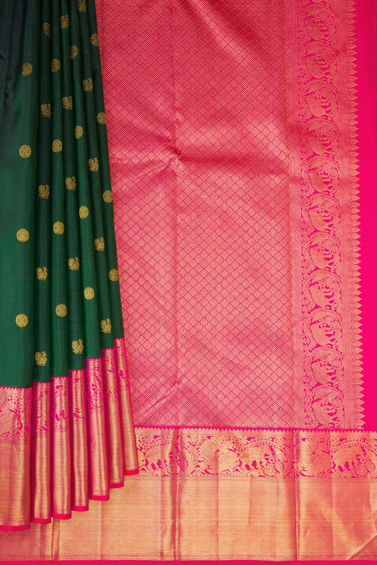 Pleats and pallu of Pure Silk Bottle Green Kanjivaram Saree with Zari Butta on the body and Zari Border. 