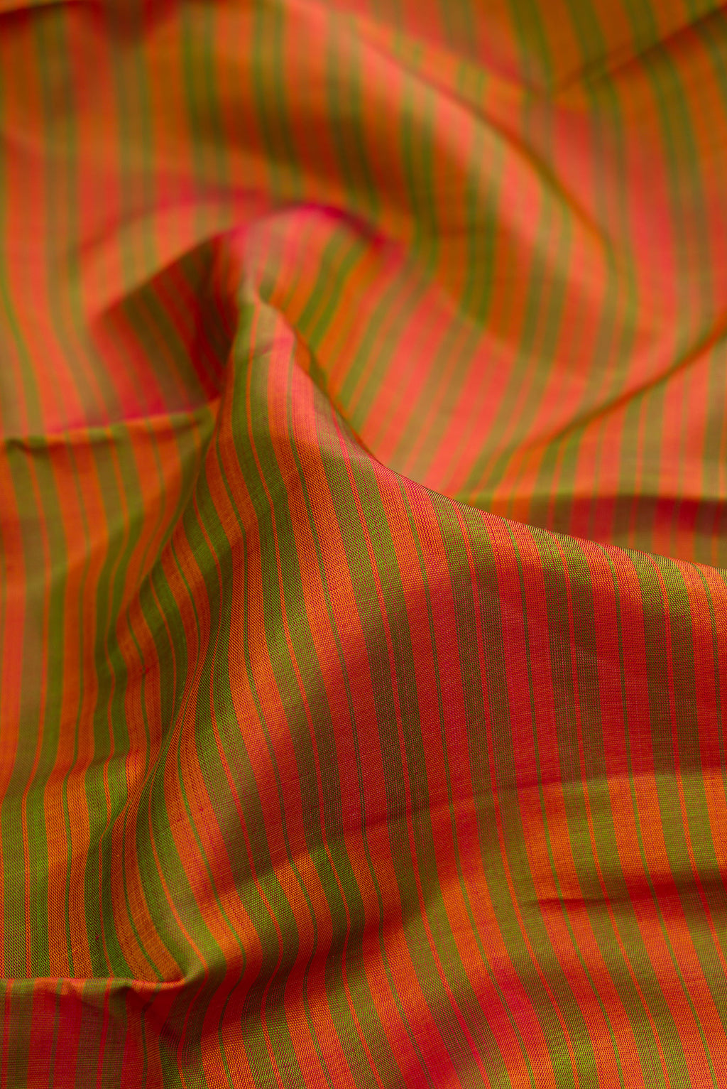 Close up of Pure Silk Mehandi Green Dual Tone Kanchipuram Saree with Stripes on the body and Zari Border.  displaying folds