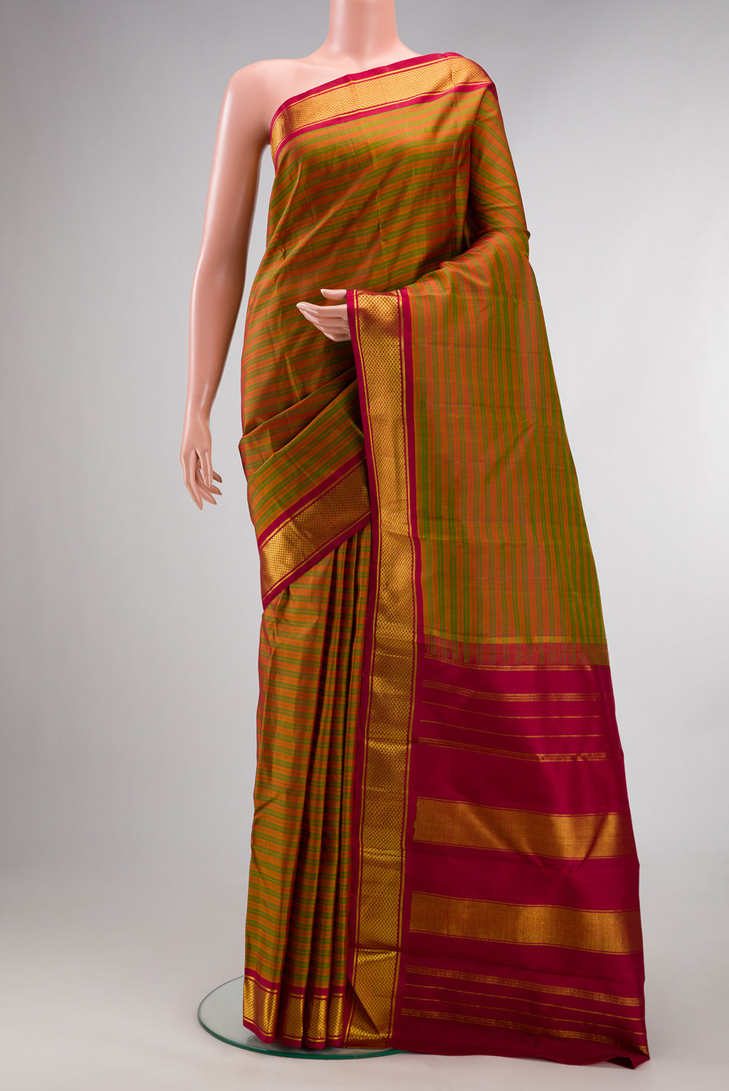 Pure Silk Mehandi Green Dual Tone Kanchipuram Saree with Stripes on the body and Zari Border.  displayed on a mannequin