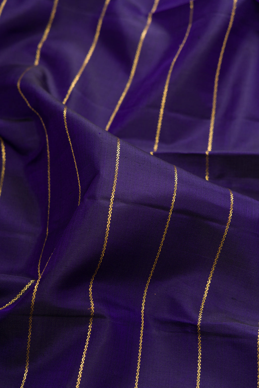 Close up of Pure Silk Navy Blue Kanchipuram Saree with Veldhari on the body and Zari Border.  displaying folds