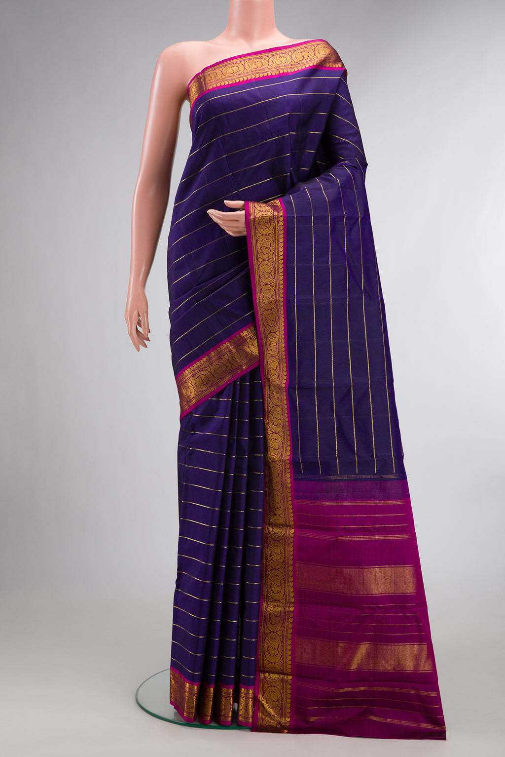 Pure Silk Navy Blue Kanchipuram Saree with Veldhari on the body and Zari Border.  displayed on a mannequin