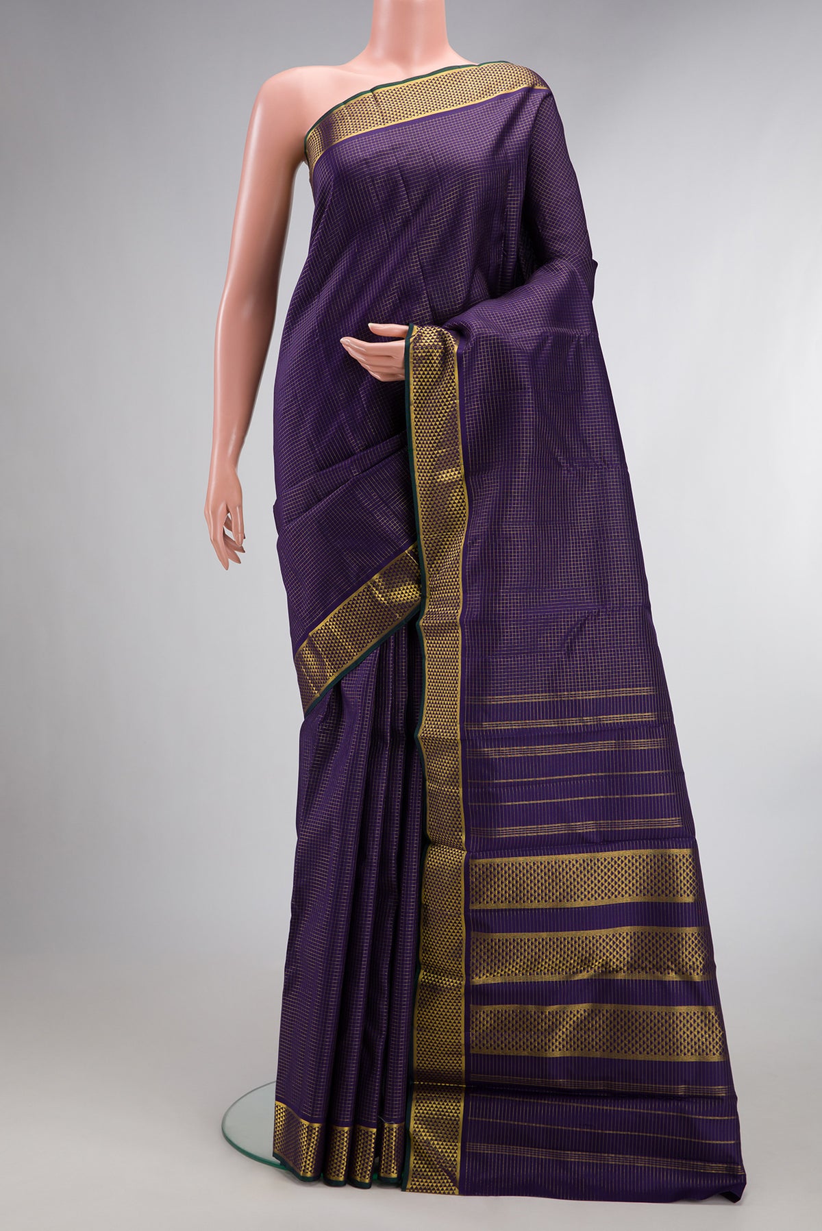 Pure Silk Navy Blue Kanchipuram Saree with Checked design on the body and Zari Border.  displayed on a mannequin