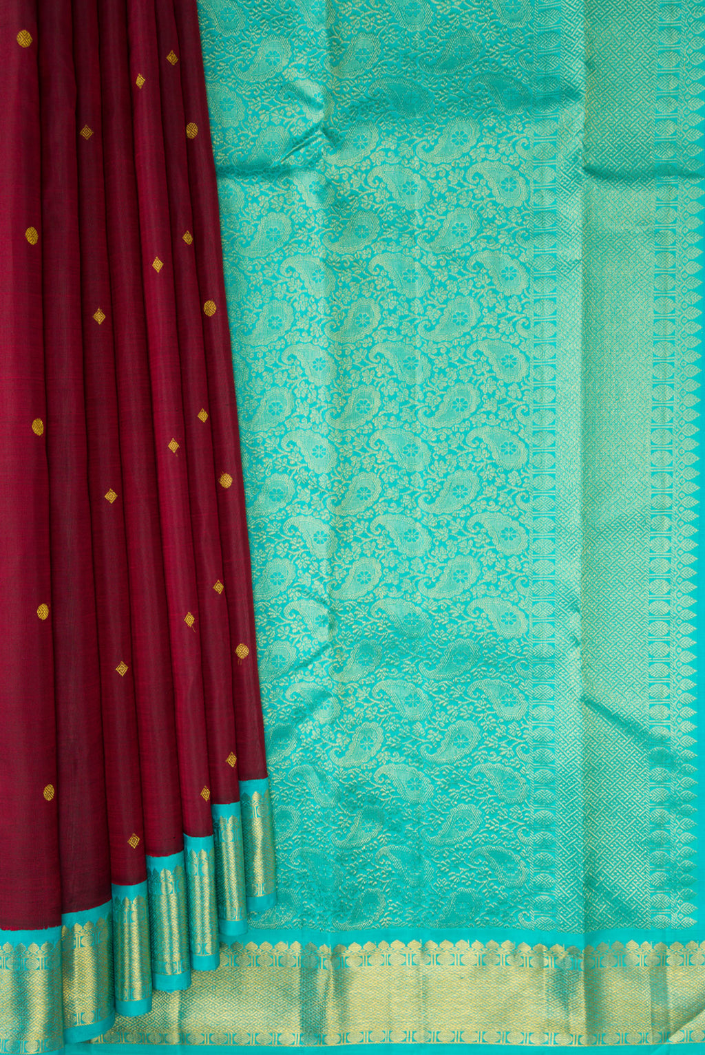 Pleats and pallu of Pure Silk Maroon Kanjivaram Saree with Zari Butta on the body and Zari Border. 