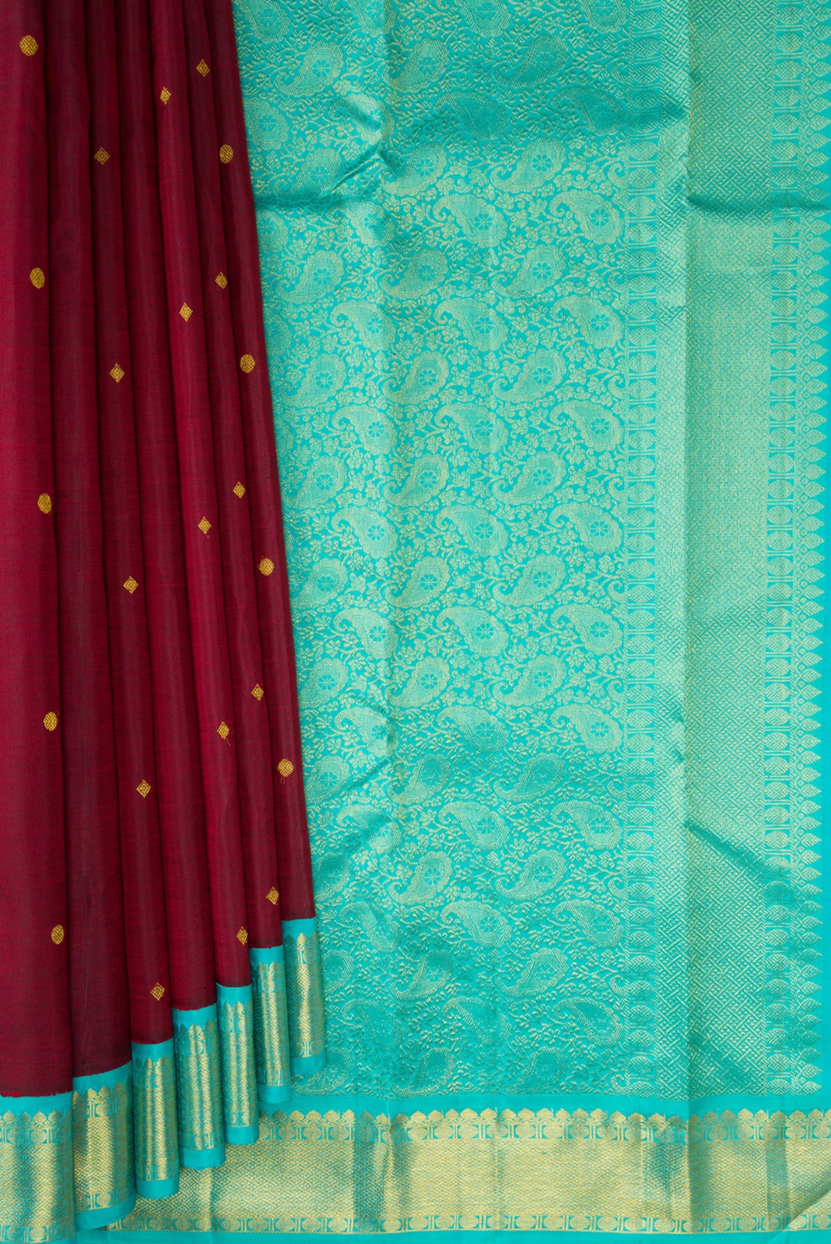 Pleats and pallu of Pure Silk Maroon Kanjivaram Saree with Zari Butta on the body and Zari Border. 