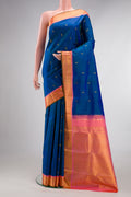 Pure Silk Peacock Blue Dual Tone Kanjivaram Saree with Zari Butta on the body and Zari Border.  displayed on a mannequin