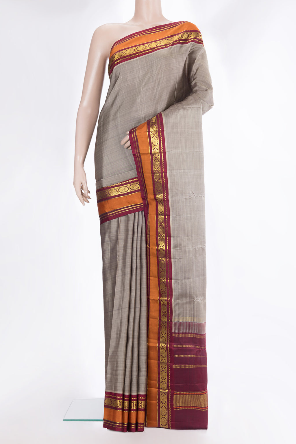 Pure Silk Grey Kanchipuram Saree with Plain Body and Zari Border.  displayed on a mannequin