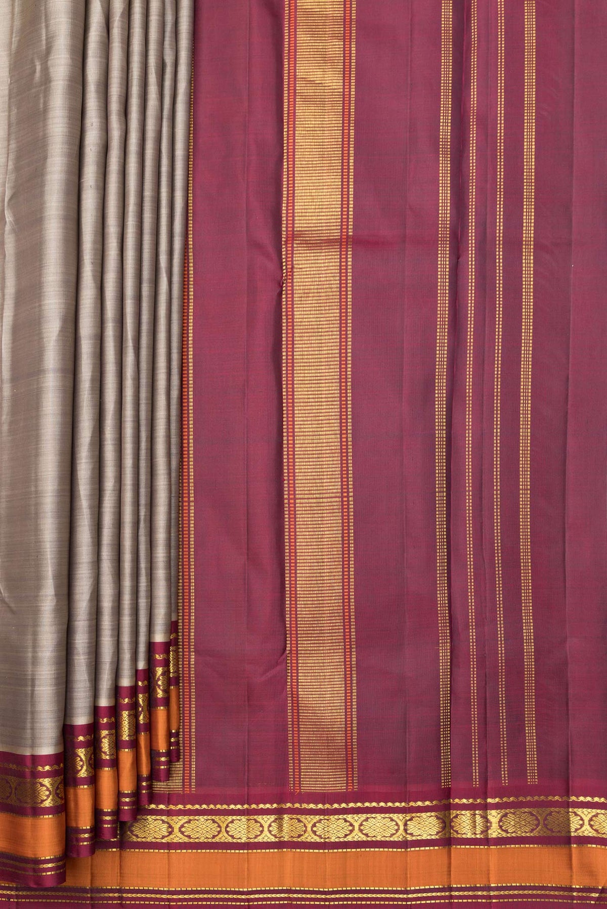 Pleats and pallu of Pure Silk Grey Kanchipuram Saree with Plain Body and Zari Border. 