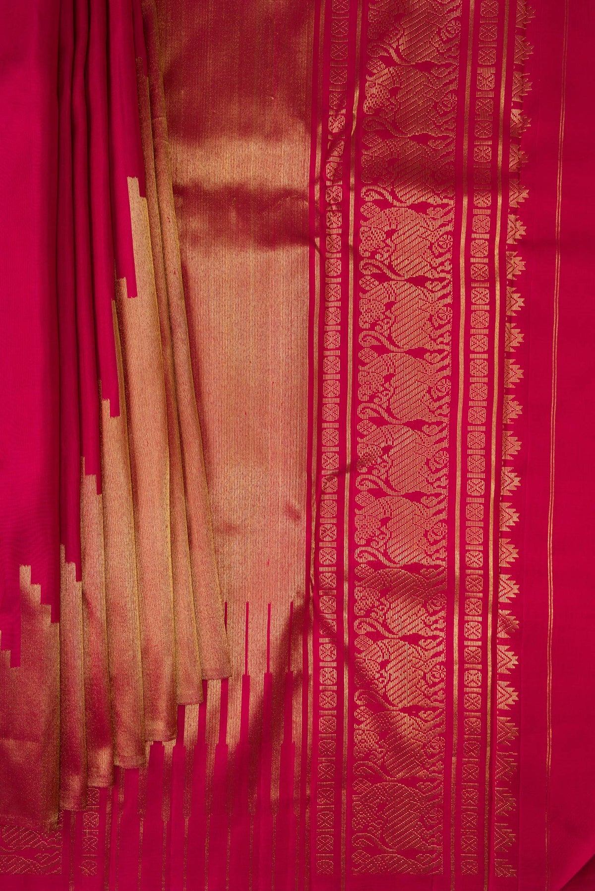 Pleats and pallu of Pure Silk Pure Zari Maroon Kanjivaram Saree with Plain Body and Rising Temple Border. 
