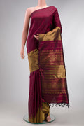 Pure Silk Pure Zari Maroon Kanjivaram Saree with Plain Body and Rising Temple Border.  displayed on a mannequin