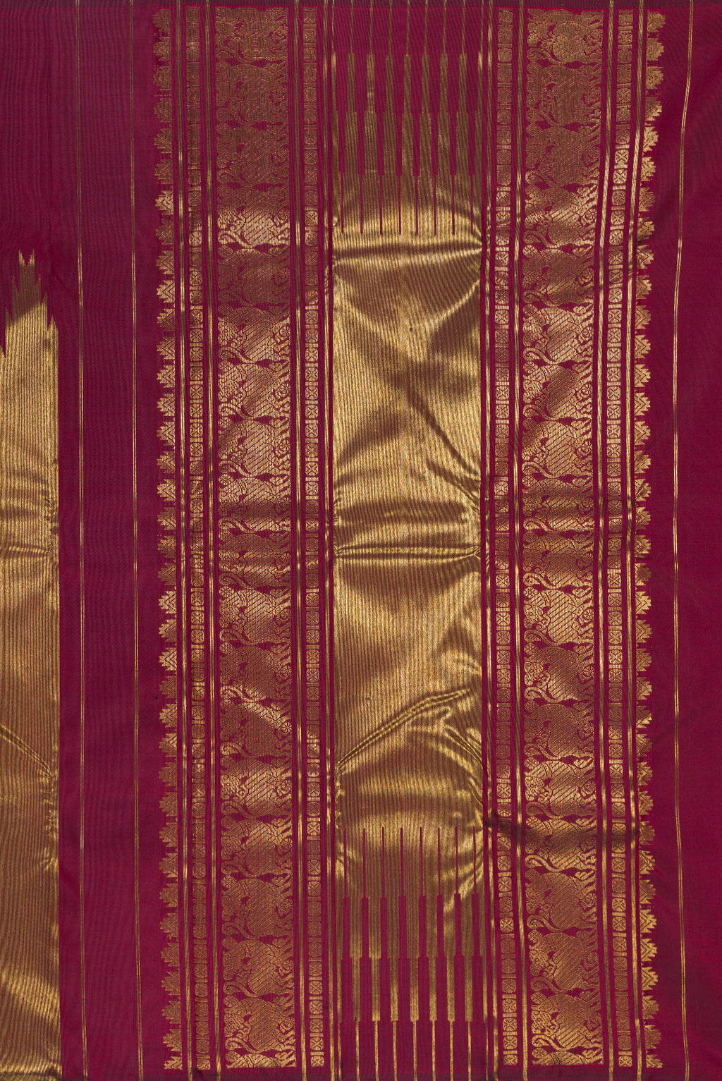 Close up image of the pallu of Pure Silk Pure Zari Maroon Kanjivaram Saree with Plain Body and Rising Temple Border. 