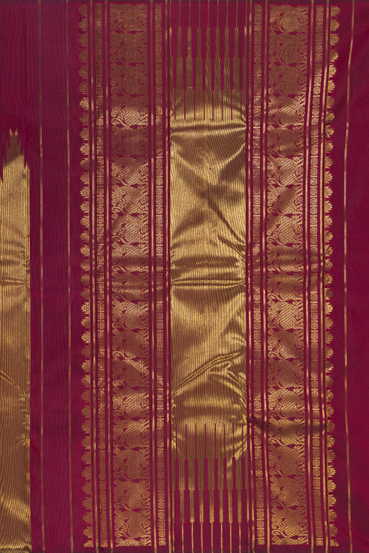 Close up image of the pallu of Pure Silk Pure Zari Maroon Kanjivaram Saree with Plain Body and Rising Temple Border. 