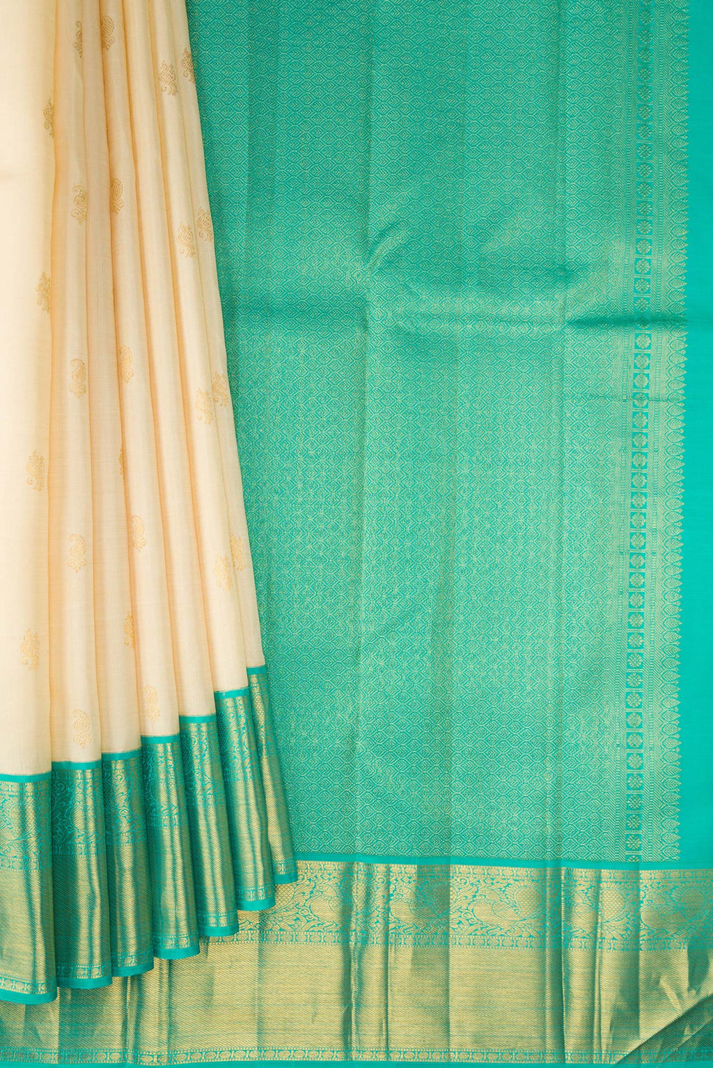 Pleats and pallu of Pure Silk Sandal Kanjivaram Saree with Zari Butta on the body and Zari Border. 