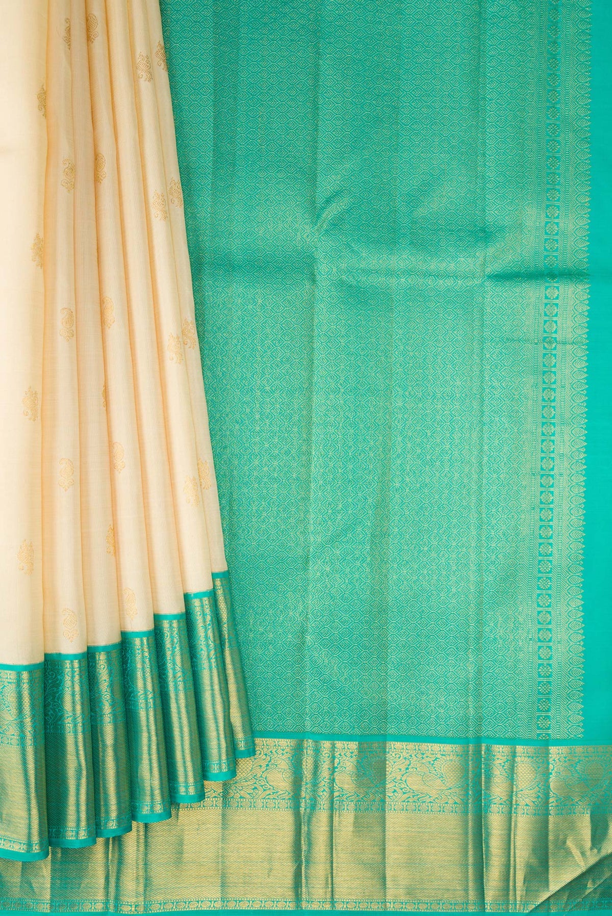 Pleats and pallu of Pure Silk Sandal Kanjivaram Saree with Zari Butta on the body and Zari Border. 