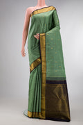 Pure Silk Sage Green Kanchipuram Saree with Zari Butta on the body and Zari Border.  displayed on a mannequin