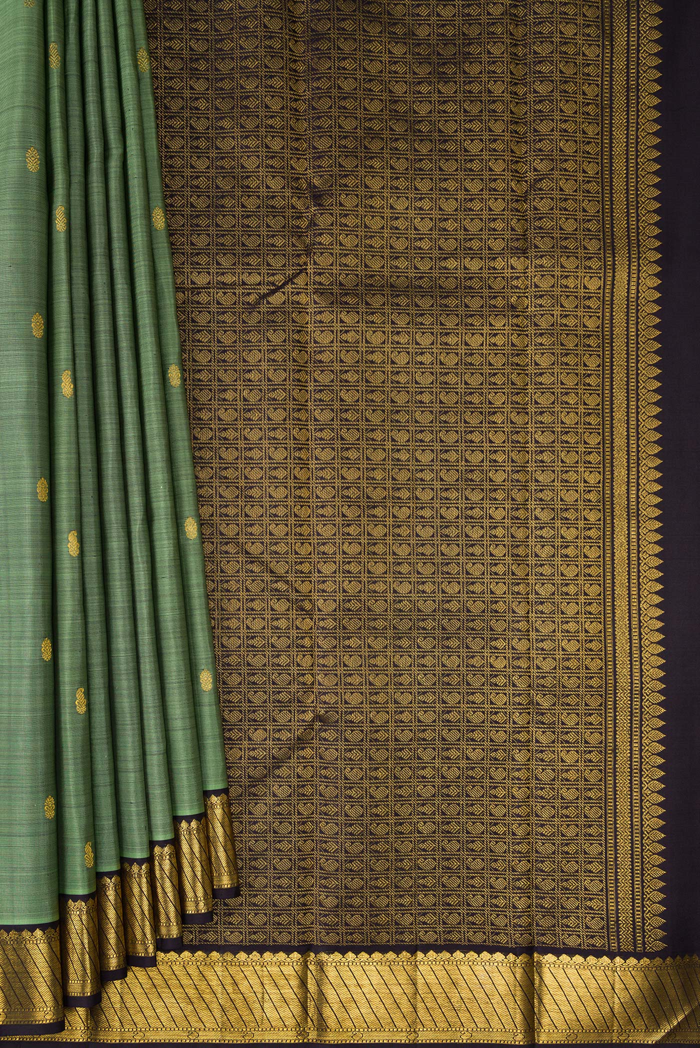 Pleats and pallu of Pure Silk Sage Green Kanchipuram Saree with Zari Butta on the body and Zari Border. 