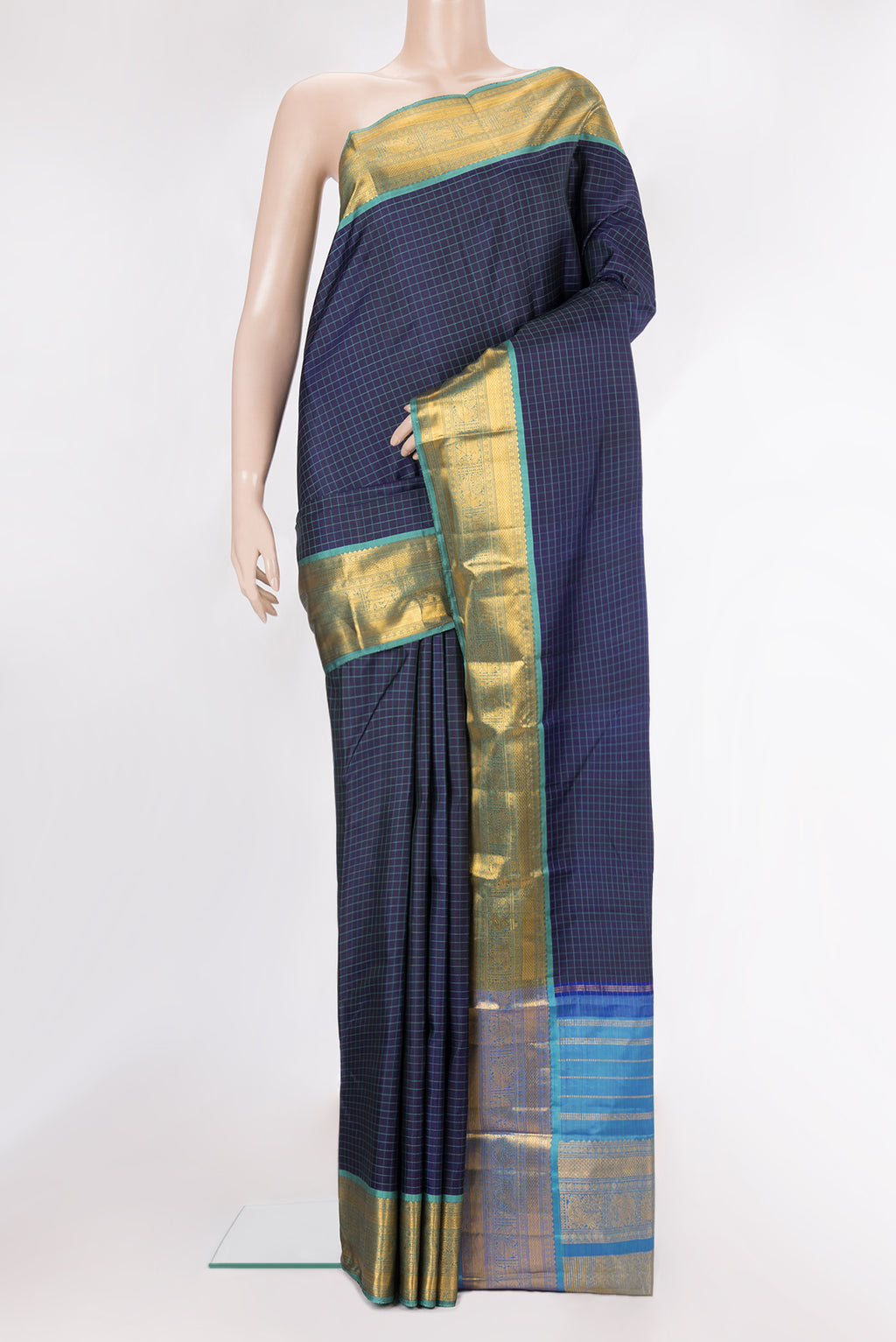Pure Silk Navy Blue Dual Tone Kanjivaram Saree with Checked design on the body and Zari Border.  displayed on a mannequin