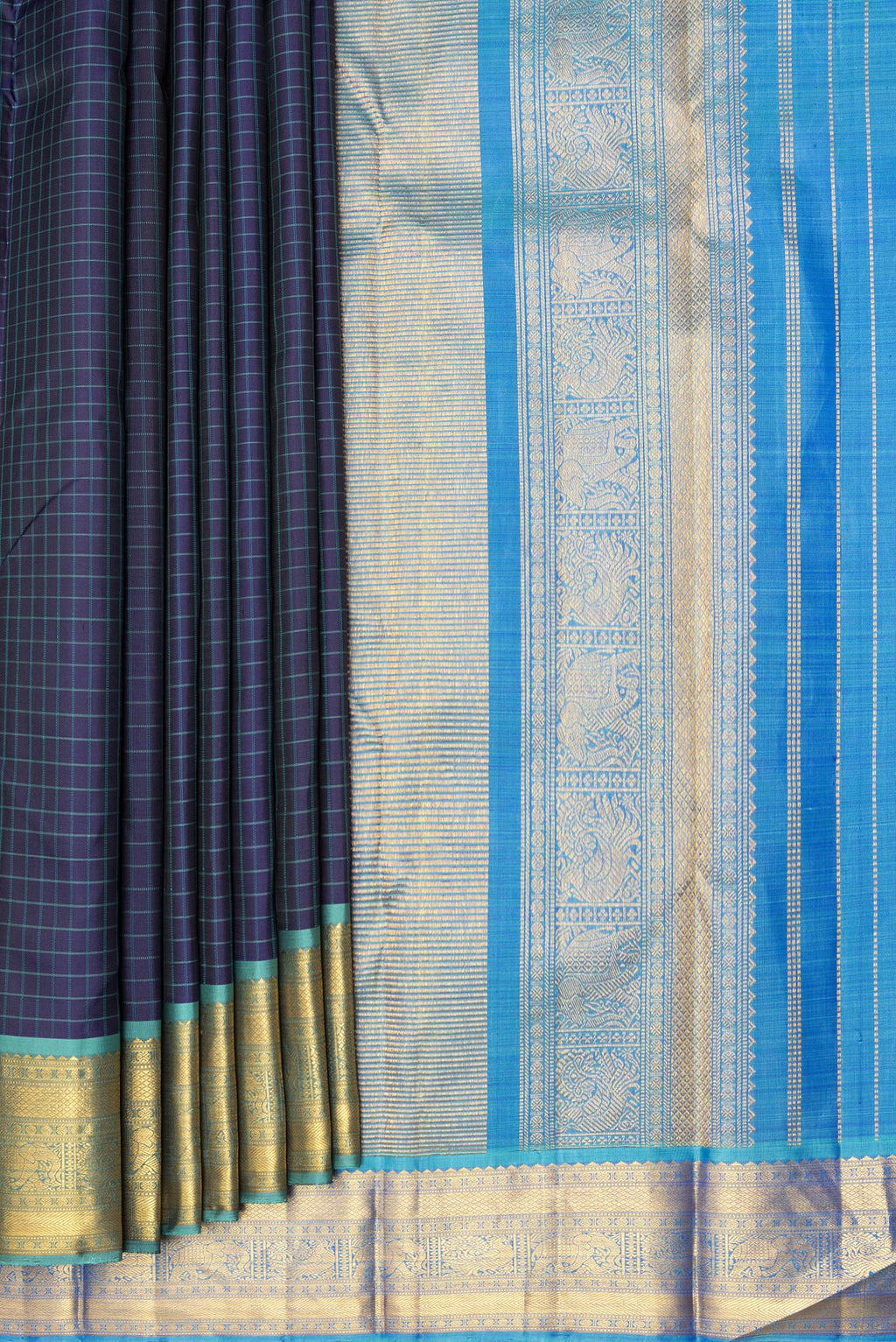 Pleats and pallu of Pure Silk Navy Blue Dual Tone Kanjivaram Saree with Checked design on the body and Zari Border. 
