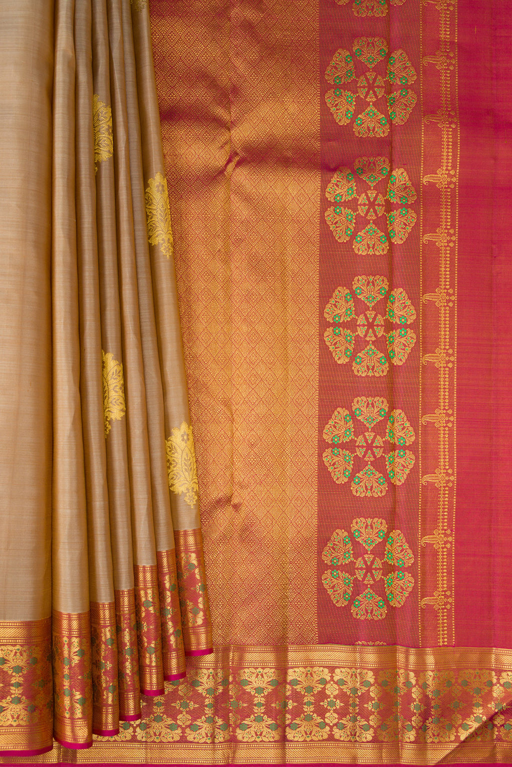 Pleats and pallu of Pure Silk Beige Kanchipuram Saree with Zari Butta on the body and Fancy Border. 