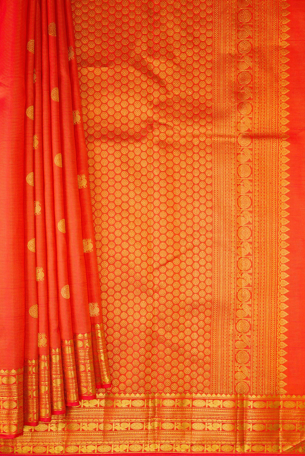 Pleats and pallu of Pure Silk Orange Kanjivaram Saree with Stripes on the body and Zari Border. 
