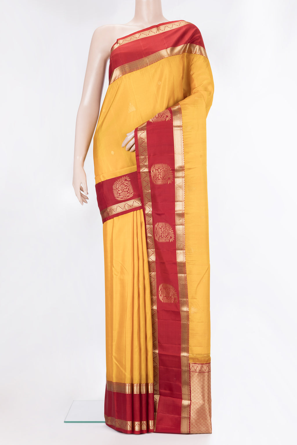 Pure Silk Yellow Dual Tone Kanjivaram Saree with Zari Butta on the body and Fancy Border.  displayed on a mannequin