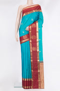 Pure Silk Sky Blue Kanjivaram Saree with Zari Butta on the body and Fancy Border.  displayed on a mannequin