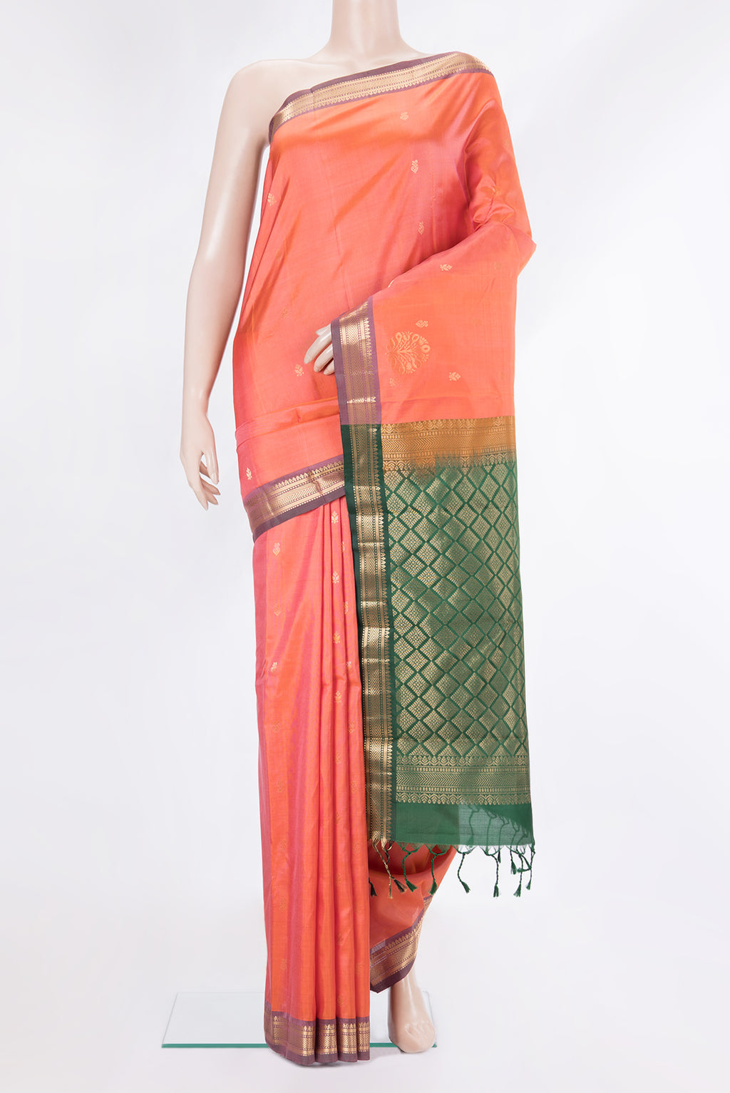 Pure Silk Golden Peach Kanchipuram Saree with Zari Butta on the body and Zari Border.  displayed on a mannequin