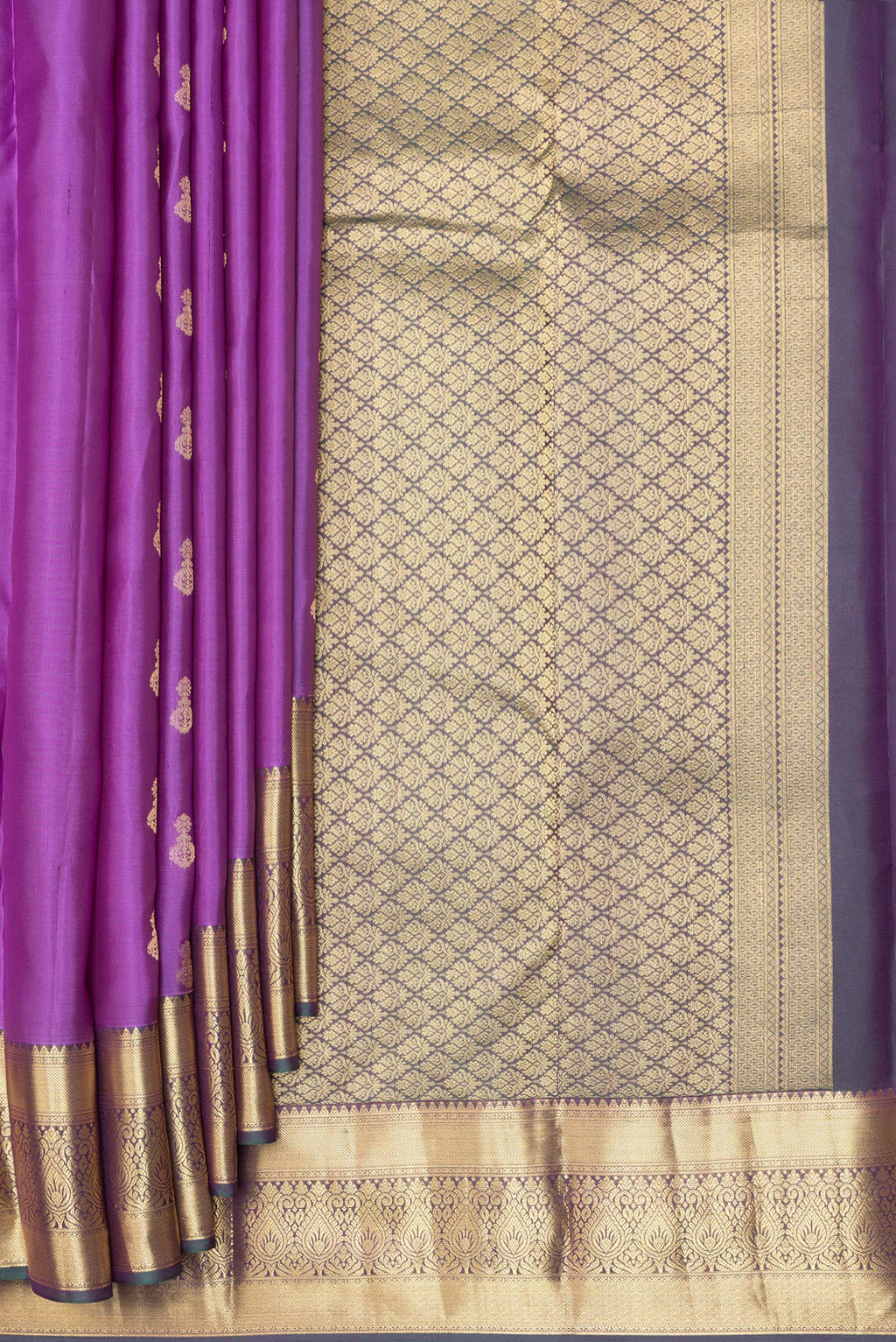 Pleats and pallu of Pure Silk Purple Kanjivaram Saree with Zari Butta on the body and Zari Border. 