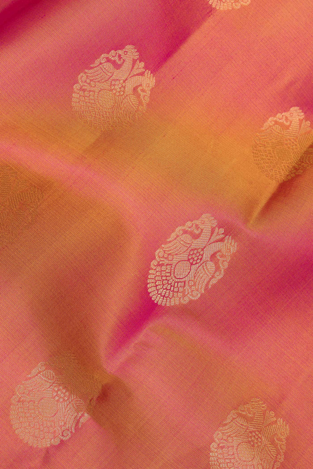 Close up of Pure Silk Mustard Kanjivaram Saree with Zari Butta on the body and Zari Border.  displaying folds