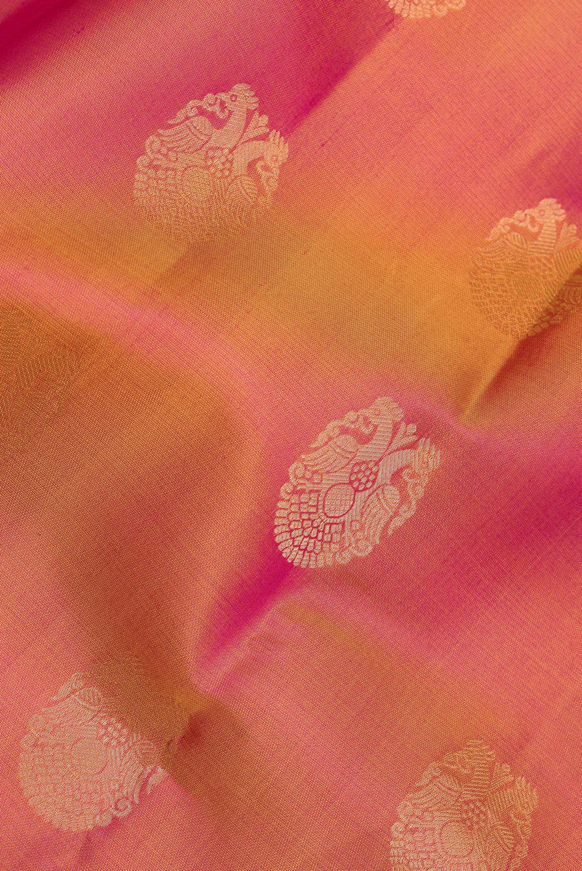 Close up of Pure Silk Mustard Kanjivaram Saree with Zari Butta on the body and Zari Border.  displaying folds