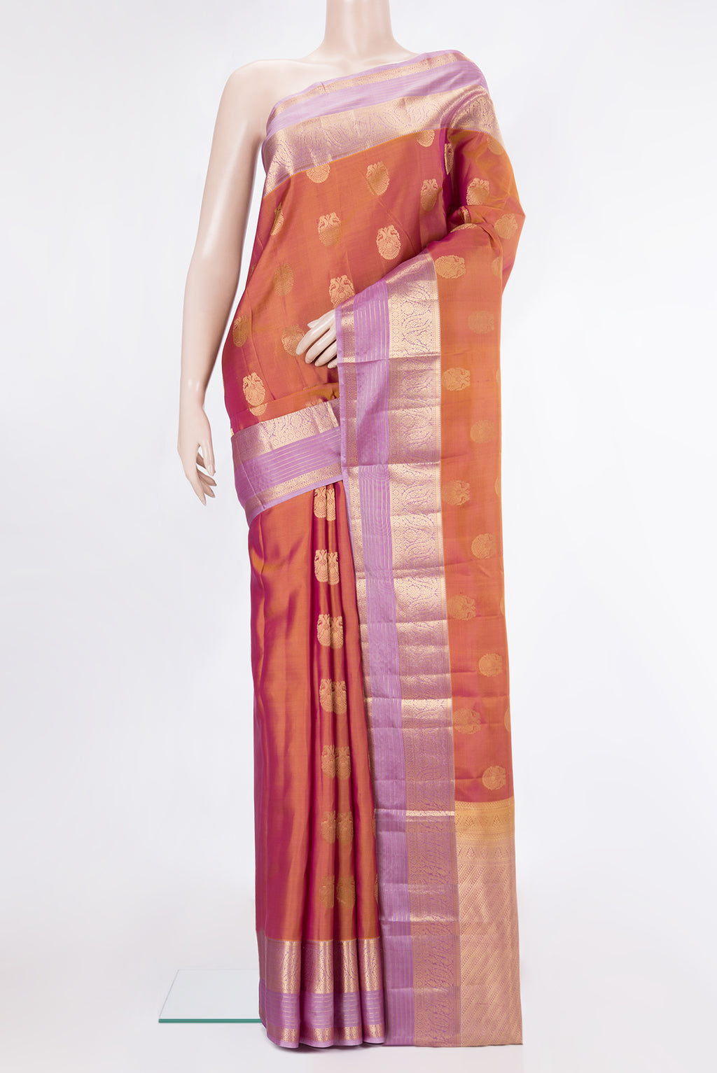 Pure Silk Mustard Kanjivaram Saree with Zari Butta on the body and Zari Border.  displayed on a mannequin