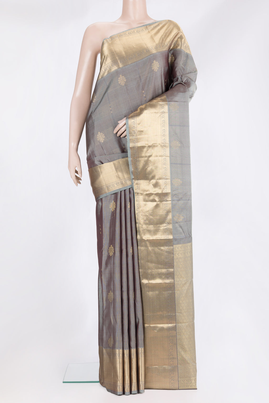 Pure Silk Grey Kanchipuram Saree with Zari Butta on the body and Zari Border.  displayed on a mannequin