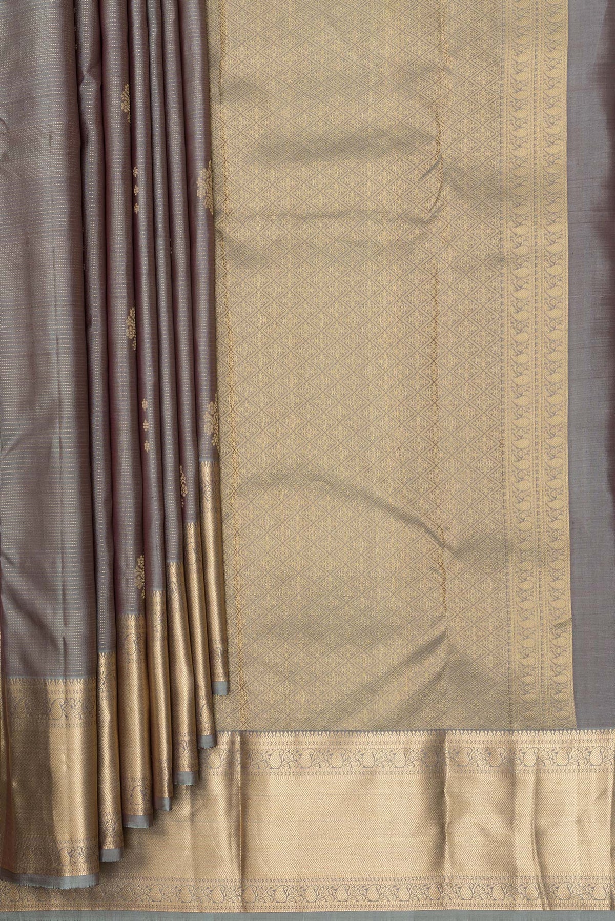 Pleats and pallu of Pure Silk Grey Kanchipuram Saree with Zari Butta on the body and Zari Border. 