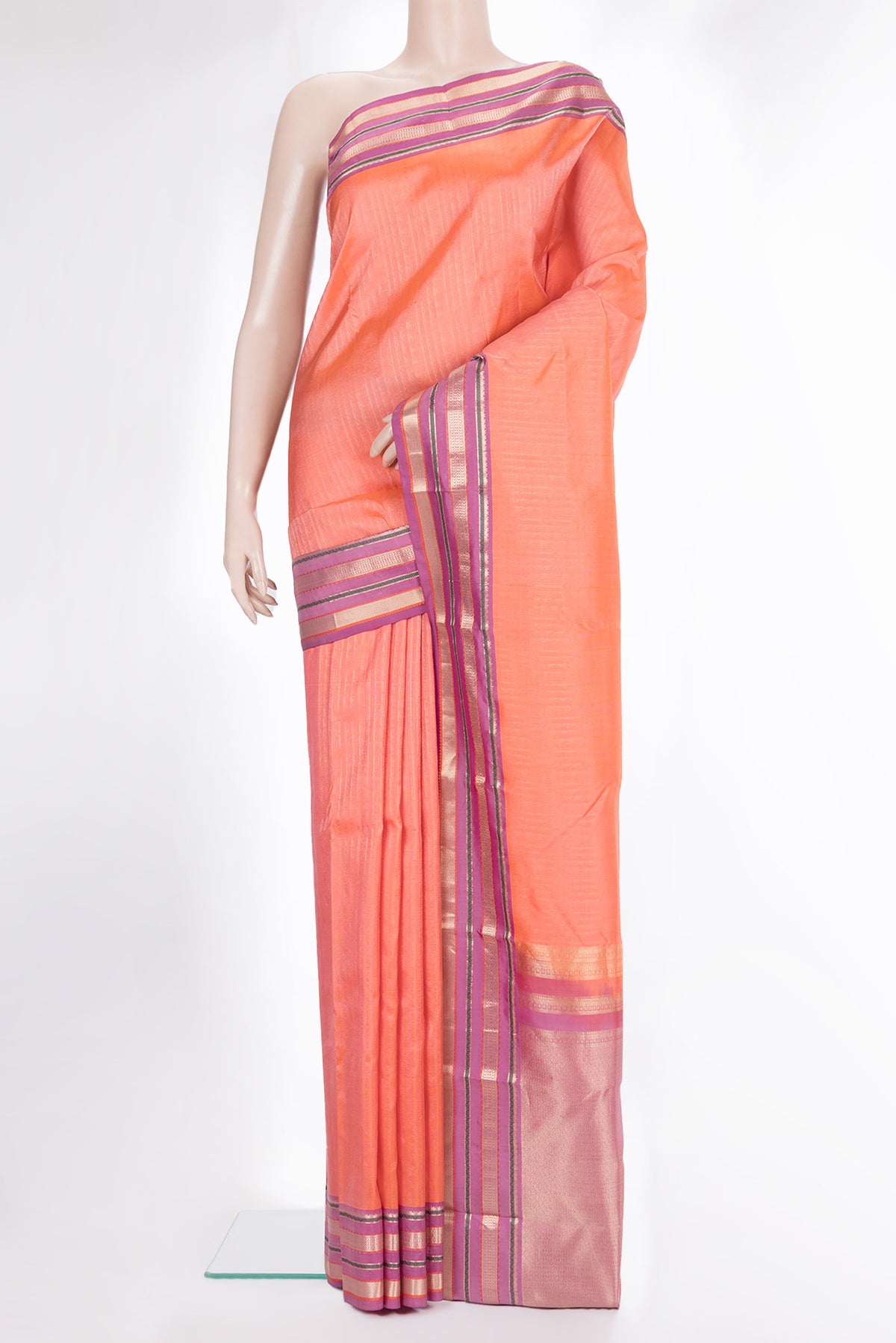 Pure Silk Peach Kanchipuram Saree with Stripes on the body and Zari Border.  displayed on a mannequin