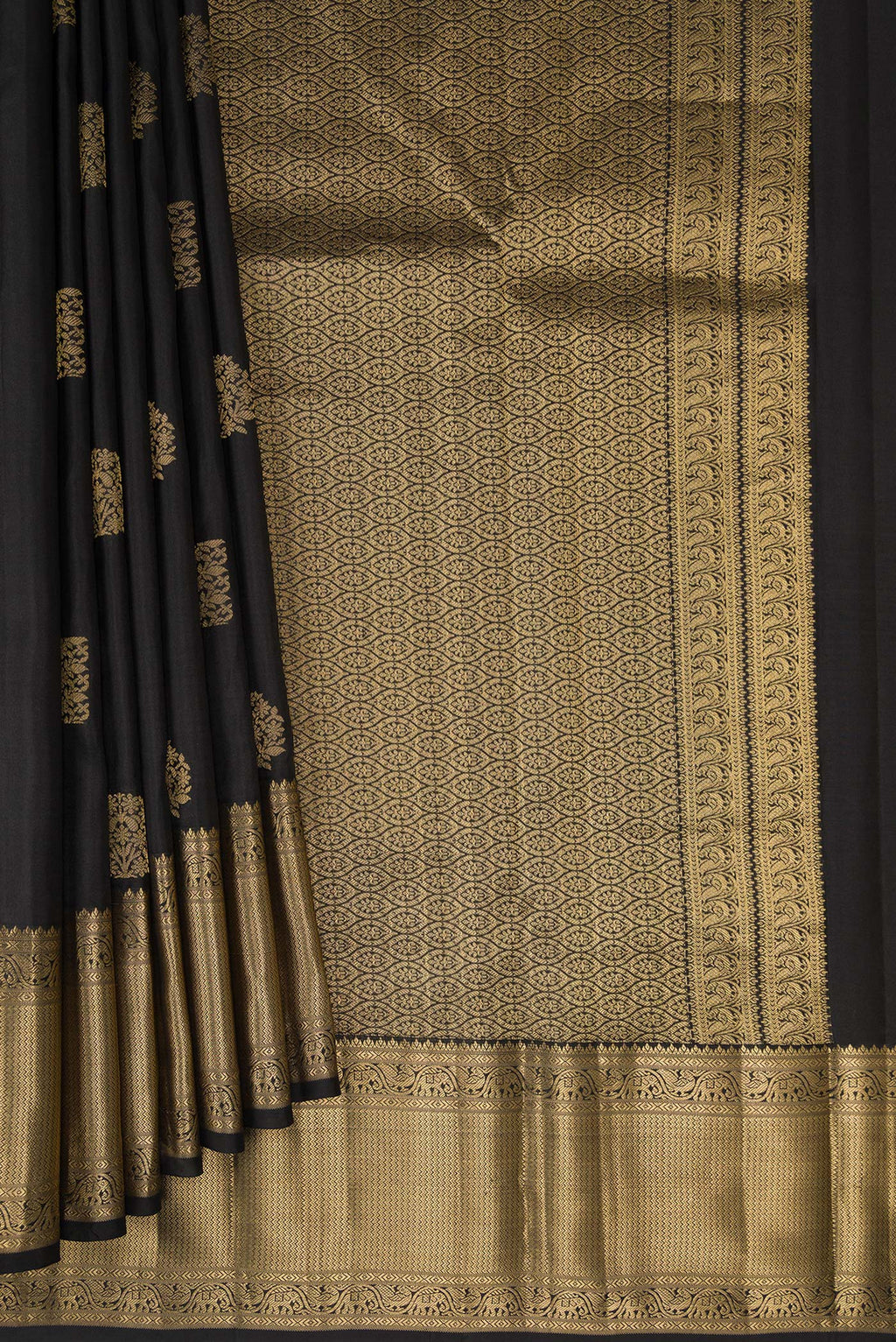 Pleats and pallu of Pure Silk Black Kanchipuram Saree with Zari Butta on the body and Zari Border. 