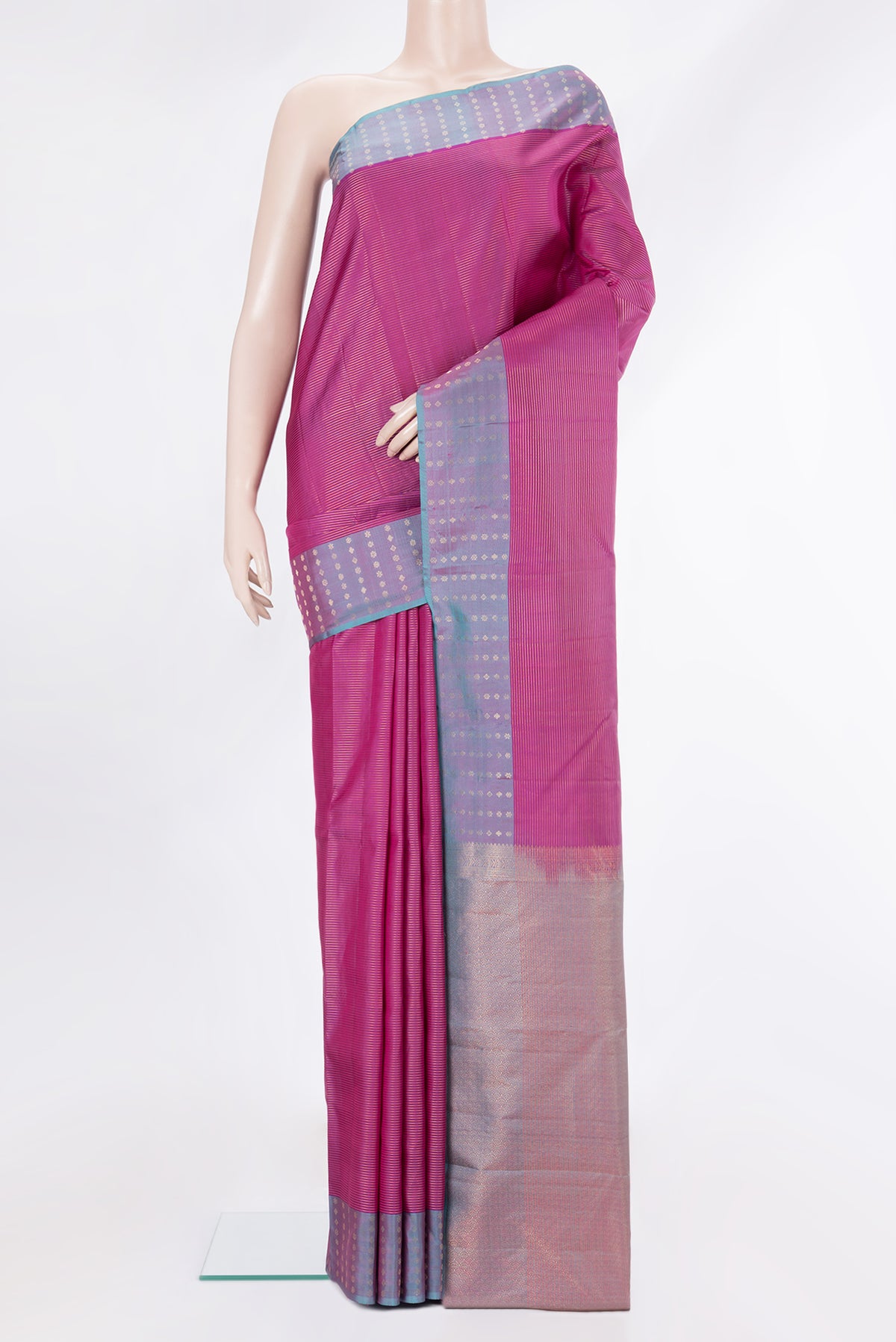 Pure Silk Magenta Kanchipuram Saree with Stripes on the body and Plain Border.  displayed on a mannequin