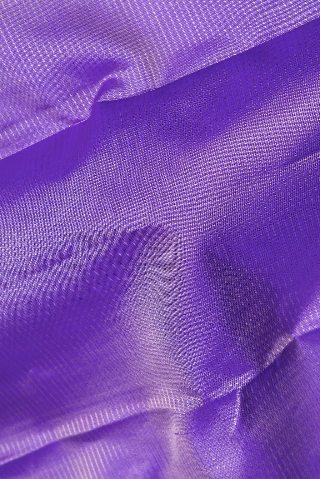 Close up of Pure Silk Lavender Kanchipuram Saree with Stripes on the body and Fancy Border.  displaying folds