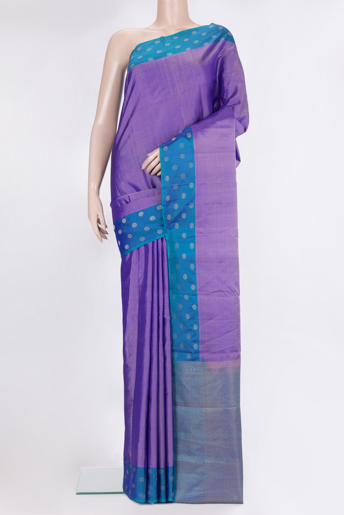 Pure Silk Lavender Kanchipuram Saree with Stripes on the body and Fancy Border.  displayed on a mannequin