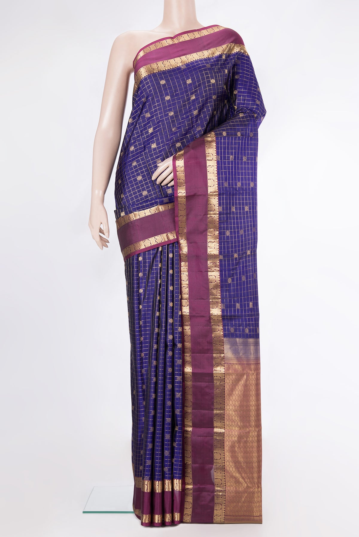 Pure Silk Dark Blue Kanchipuram Saree with Checked design on the body and Zari Border.  displayed on a mannequin