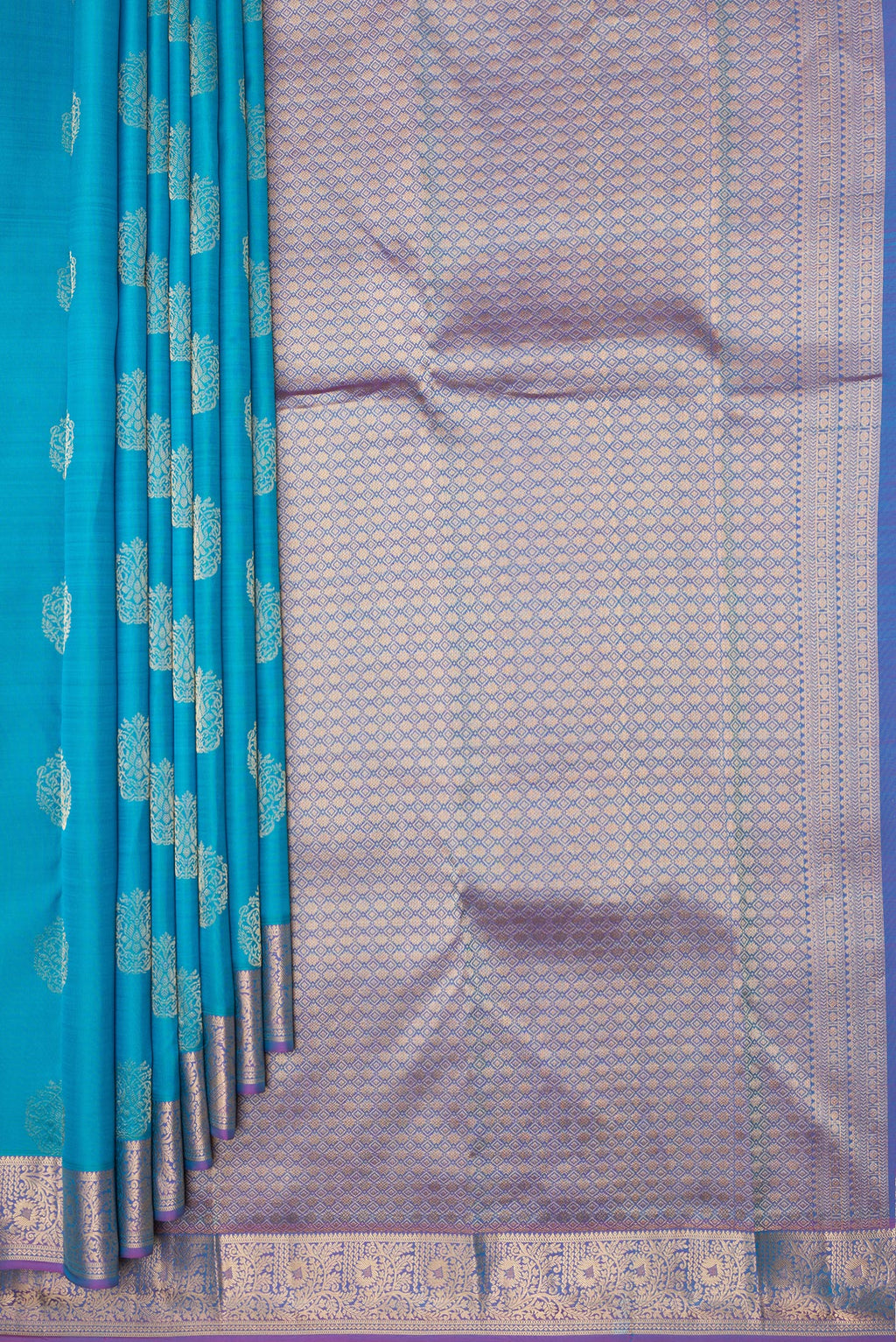 Pleats and pallu of Pure Silk Sky Blue Kanchipuram Saree with Zari Butta on the body and Zari Border. 