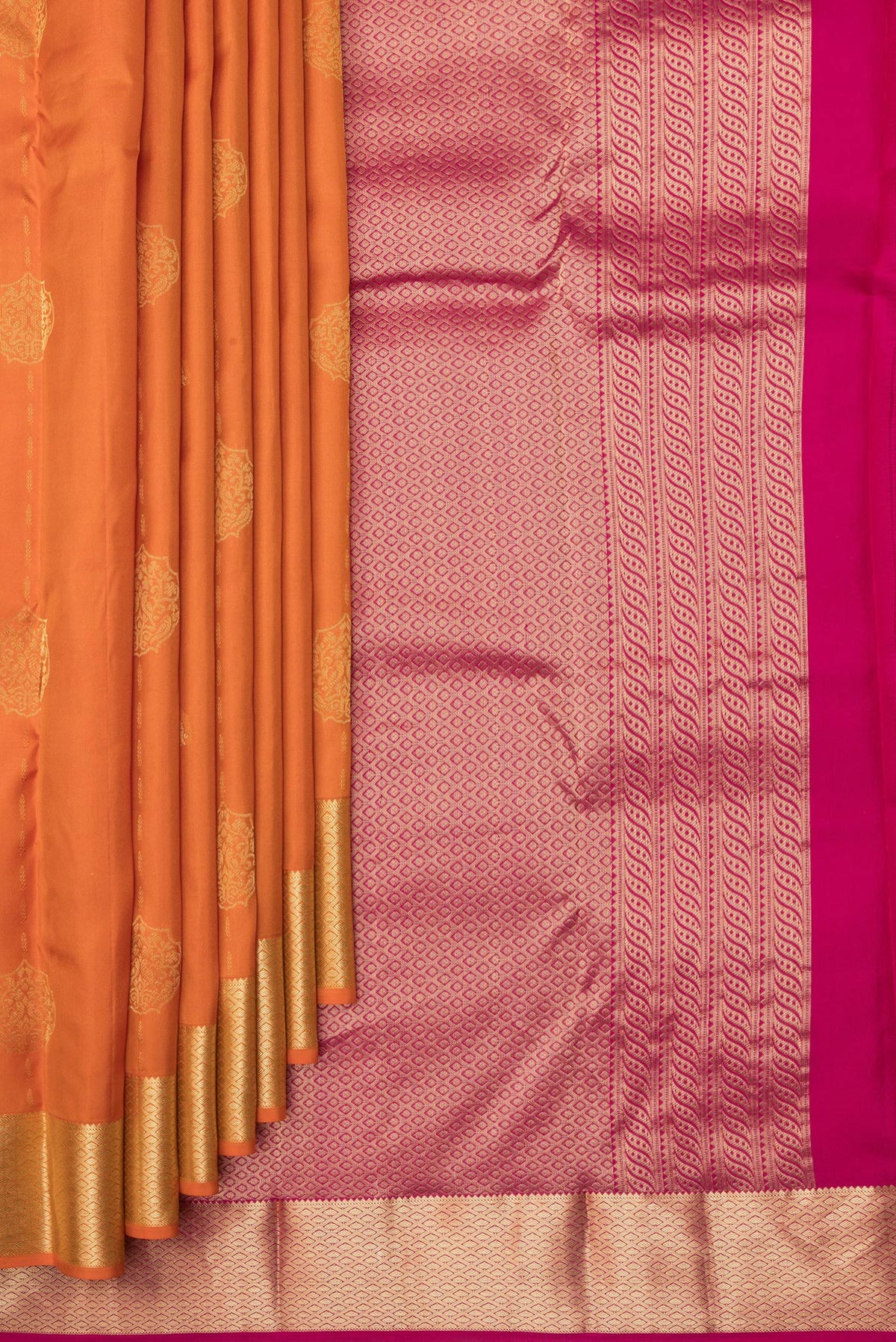 Pleats and pallu of Pure Silk Orange Kanchipuram Saree with Zari Butta on the body and Zari Border. 